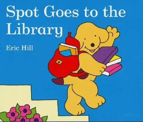 Book cover of 'Spot Goes to the Library' by Eric Hill with a cartoon dog carrying books against a blue background.