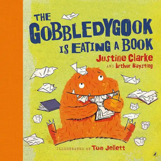 Book cover of 'The Gobbledygook is Eating a Book' with an orange creature eating books.