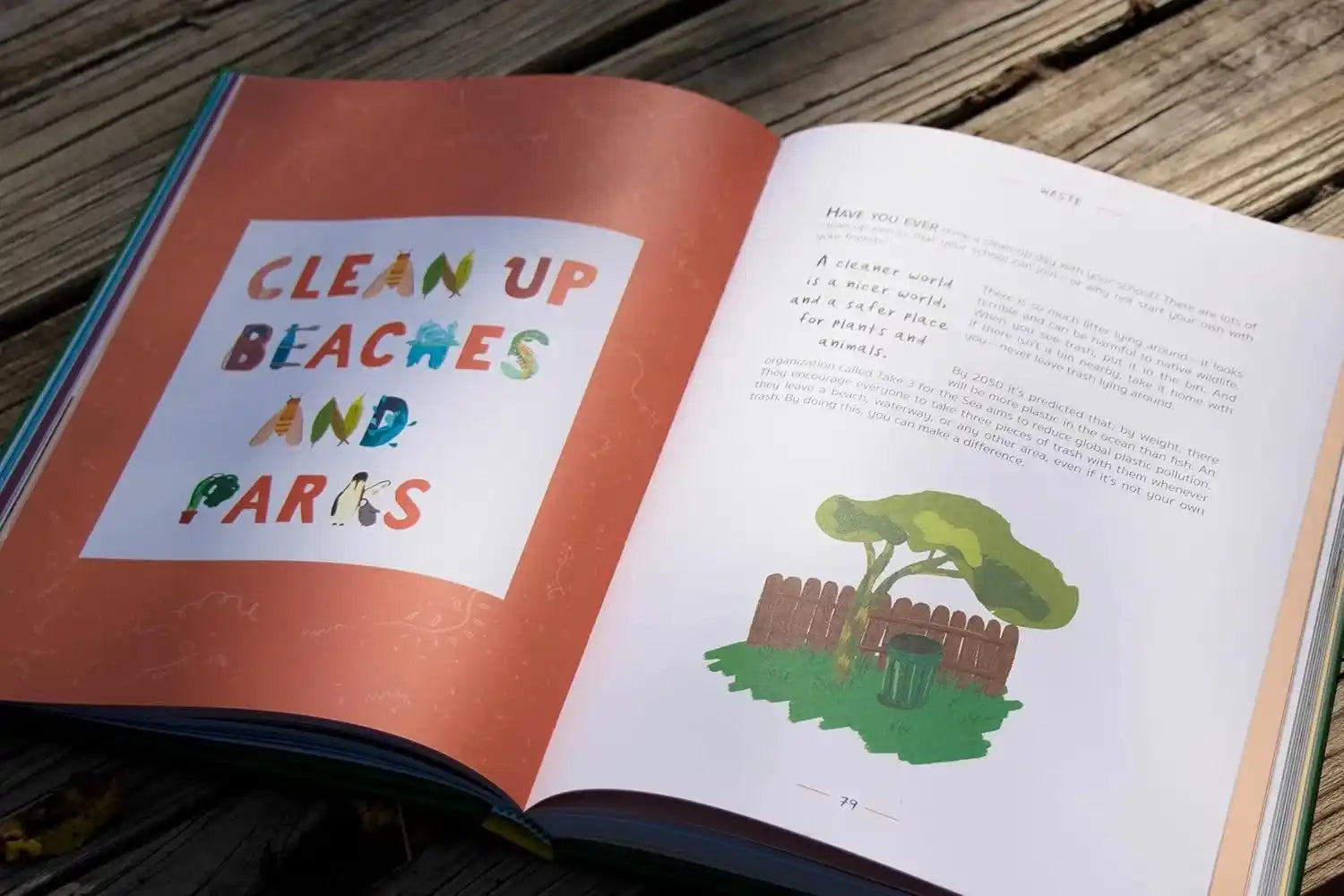 Open book with colorful text and illustration on a wooden surface